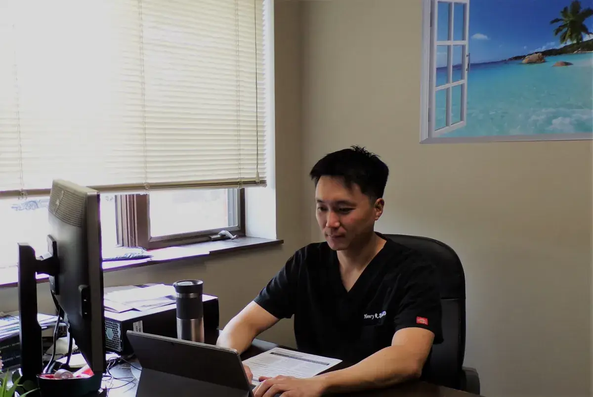 Dr. Henry Kim planning a cosmetic dental treatment at My Bloomingdale Dentist in Bloomingdale, IL
