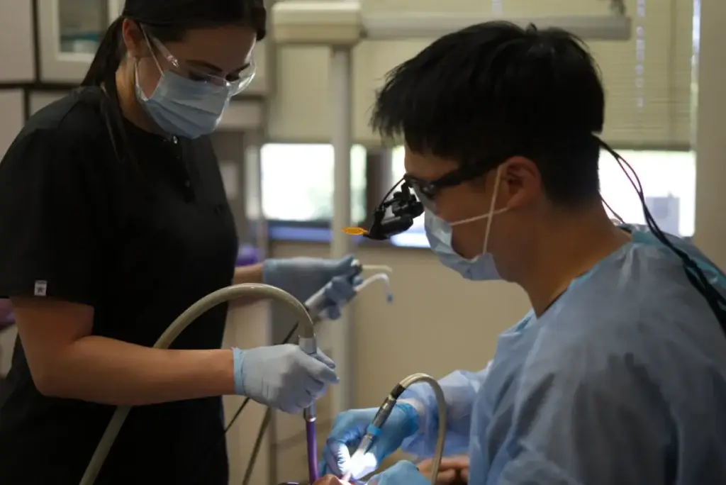 Dr. Henry Kim performing a dental procedure at My Bloomingdale Dentist in Bloomingdale, IL
